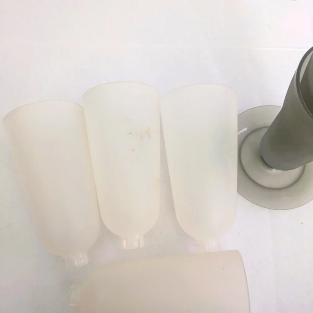 Vintage Tupperware dessert cups. 3 gray, 4 white, only one gray base included.